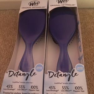 Two blue wet hair brushes